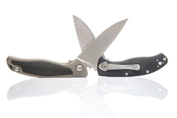 two folding knives on a white background. item for tourism and survival.