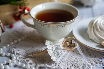 A cup of tea, New Year's toys, a calendar for the New Year 2024. Still life in vintage style.