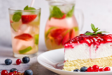 Cheesecake with fresh strawberries, red currants and blueberries