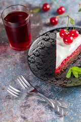 Cherry cake decorated with fresh cherries