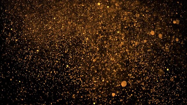 4K Multicolored abstract glitter particles. Shimmering Particles Falling glitter with glare on a bokeh background. Titles in awards, music, wedding, anniversary, party, and presentation backdrops.