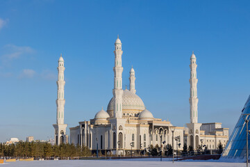Panoramic view of snow-white modern Hazaret Sultan mosque sunny morning, Nur-Sultan, Astana,...