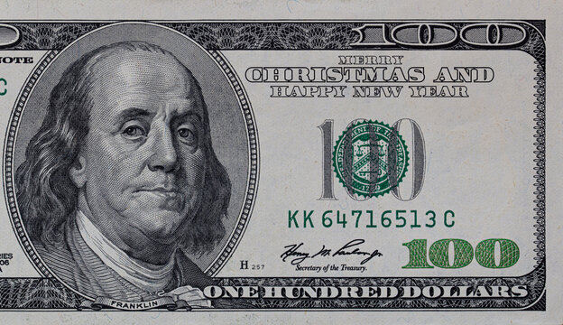 US 100 dollar banknote with Merry Christmas and Happy New Year inscription