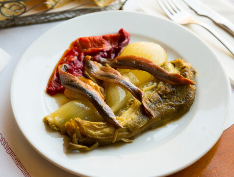 Traditional Spanish dish Escalivada con anchoas - roasted red pepper, eggplant and onion with anchovies
