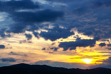 brightly colorful clouds in the evening sky. Lush colored clouds in the sky before sunset. dawn in the clouds