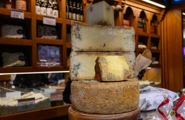 Different Asturian cheeses made from cow, goat and sheep melk on display in farmers cheese shop,...