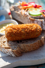 Dutch fast food, deep fried croquettes filled with ground beef meat served on bread