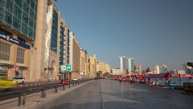 sunset time dubai city famous deira area traffic street walking panorama 4k timelapse uae