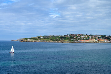 View on houses and San Lorenzo beach in Gijon, Asturias, Spain