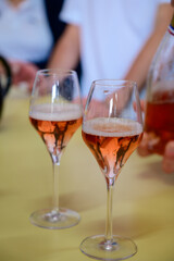 Tasting of sparkling rose wine with bubbles champagne on summer festival route of champagne in Cote des Bar, Champagne region, France