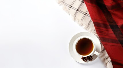 a cup of steaming coffee and a plaid set against a clean white background, the winter concept in a top-down flat lay style, providing generous copy space for holiday messages or branding
