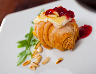 Mini croissant with Camembert, raspberry jam and roasted pine nuts
