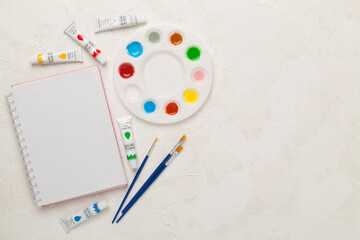 Painting tools on concrete background, top, view