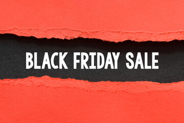 Fototapeta na wymiar BLACK FRIDAY SALE words on a black piece of paper. November is promotion time in stores and online.