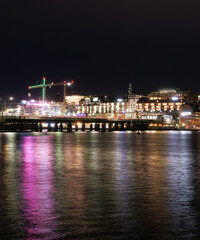 Fototapeta na wymiar View of bridge over river at night