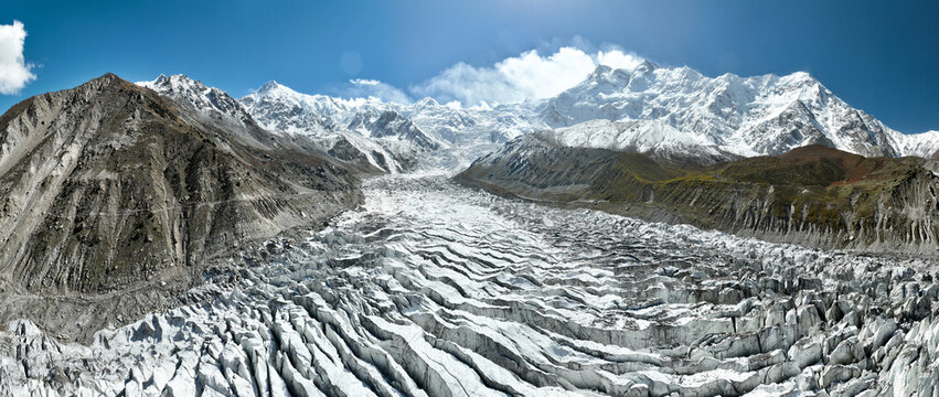 Panorama of white glacier with "Nanga Parbat" the 9th highest peak in the world, called "Killer Mountain". Landmark in northern Pakistan. Beautiful scenery of high mountains with trail to base camp
