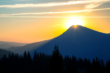 Morning sunrise over the top of a mountain in the Ukrainian Carpathians