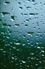 Rain falling on glass, textured background