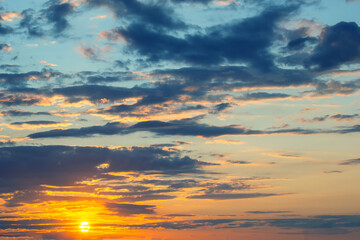 brightly colorful clouds in the evening sky. Lush colored clouds in the sky before sunset. dawn in the clouds