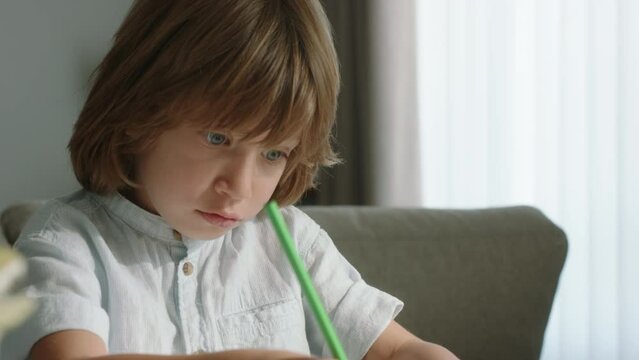 Portrait of drawing kid. Cinematic. With pencil in hand, world of wonder, where colors come alive and dreams take flight. Innermost desires, testament to limitless potential of creative development