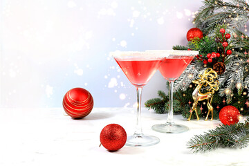 Christmas alcoholic cocktail with red martini, lemonade, champagne in glasses on festive background...