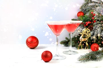 Fotobehang Christmas alcoholic cocktail with red martini, lemonade, champagne in glasses on festive background with fir branches and decorations, bar concept, alcoholic drinks at party, © Светлана Балынь