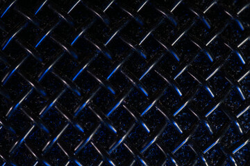 Black metal microphone grille, background texture