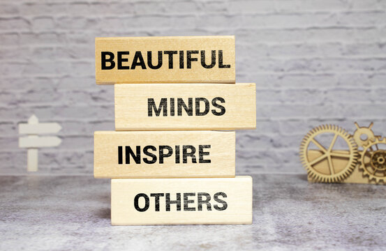 Beautiful Minds inspire others. Yellow piece of paper with text.