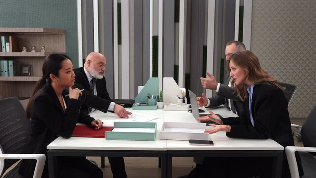 Business partners sitting in company office building and dispute about work, throw papers into each other. Company corporate meeting. Tensely business people office workers lawyers investors. 4k