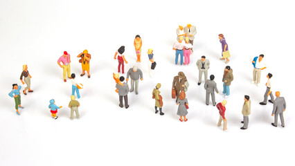 miniature people. group of different people communicate with each other on a white background....
