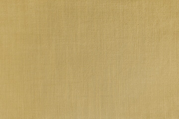 Texture background of yellow linen fabric. Textile structure, cloth surface, weaving of natural cotton fabric closeup, backdrop, wallpaper.