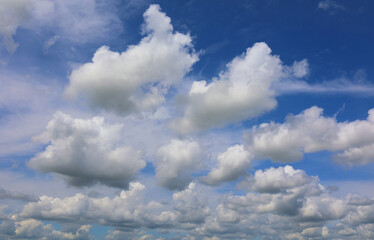 Naklejka na ściany i meble Clouds on blue clear sky in summer time