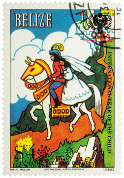 Prince with princess at horse - scene from a fairy tale on postage stamp