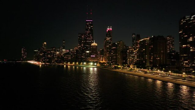 Drone view of lake shore drive in Downtown Chicago at night time 