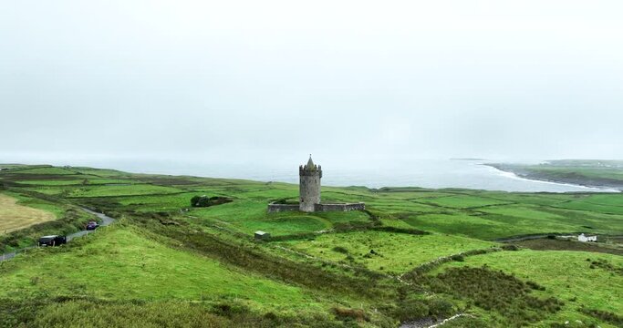 Aerial view over the beautiful Doonagore Castle off the west coast of Ireland