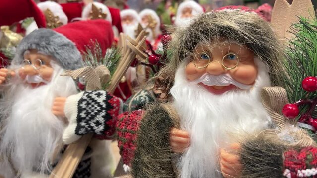 Santa Claus figurines are on sale in a store before Christmas