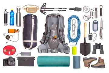 Set of tourist trekking items on white background. Top view of accessories for travel. Equipment for travel and hiking. Survival Items.