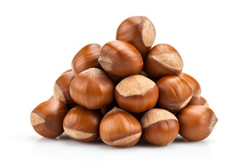 A pile of hazel nuts sitting on top of each other.