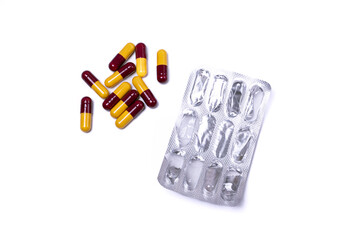 Pills and its package isolated on white background. After some edits.