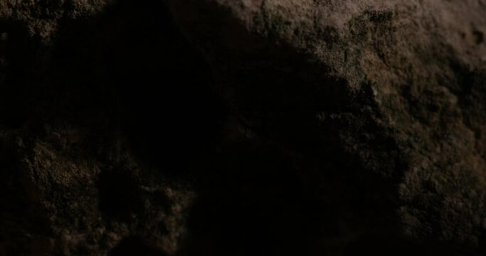 Rock Stone texture close-up. Rought mountain surface. Geological sample. Wall in cave. Macro shot natural mineral background. 