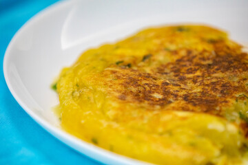 Traditional cassava puree grilled in a pan with pan meat (meat stew)