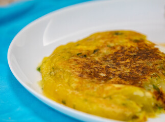 Traditional cassava puree grilled in a pan with pan meat (meat stew)