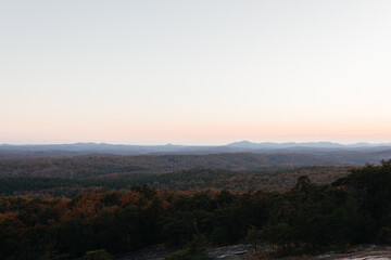 Sunset in the mountains in autumn. Landscape with mountains and picturesque sky at dawn. Horizon. Bird's eye view panorama. Bald Rock, Great Smoky Mountain National Park, South Carolina, USA