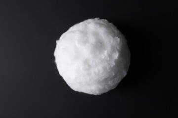 Ball of clean cotton wool on dark background, closeup