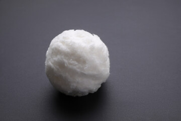 Ball of clean cotton wool on grey background, space for text