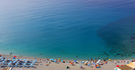Bathers on the beach in Scilla Calabria Italy - obrazy, fototapety, plakaty