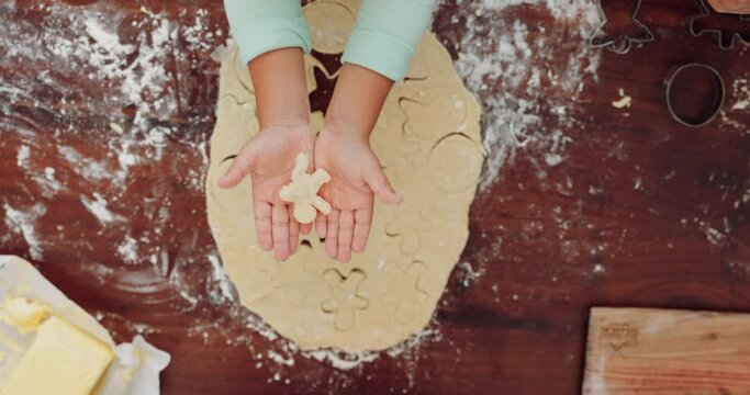 Hands, baking and kid with shape in top view for learning in home with cookies for development. Dough, tools and teaching with child or flour for support with process or recipe for ginger bread man