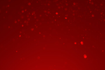red glitter vintage lights background. red bokeh shiny on dark background.