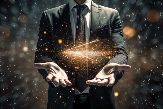 Businessman in the suit is gesturing with his hands as if he's scooping something up. Shining particles of light and abstract effects. Business innovation, IT technology, inspiration and idea concept