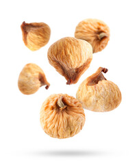 Many dried figs falling on white background